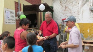 Randy giving out hot dogs