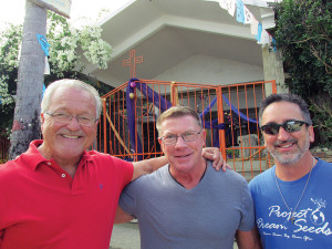 Tim (center) volunteers every Wed. at Quimixto and Dave (right) supports the work and gave blue bracelets
